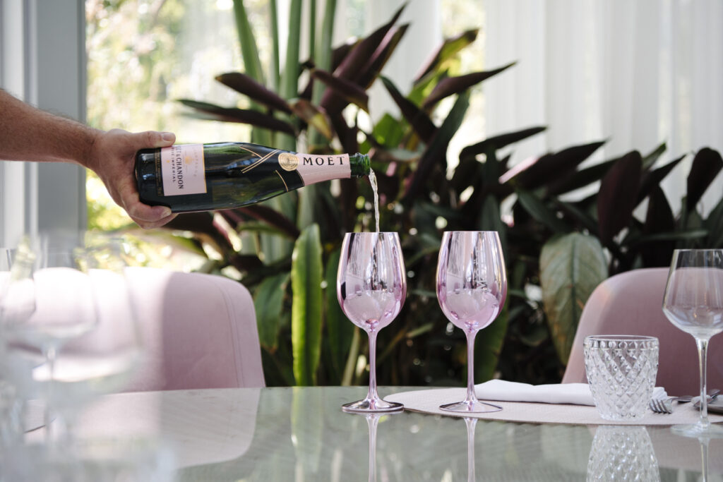 A wine pouring in a glass - The Botanica Drinks