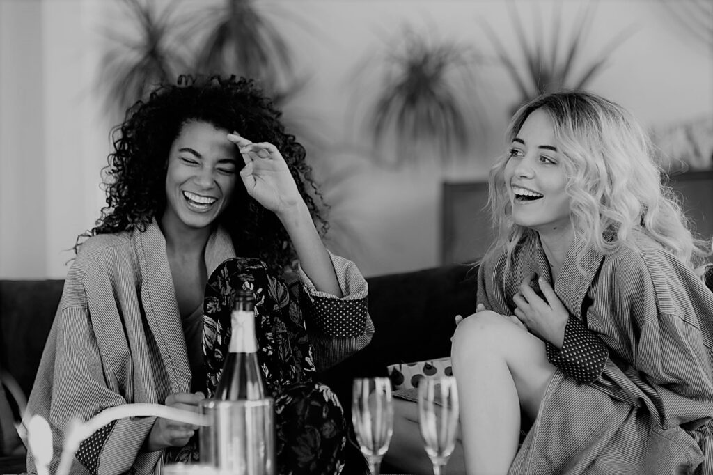 Friends Drinking Champagne And Laughing